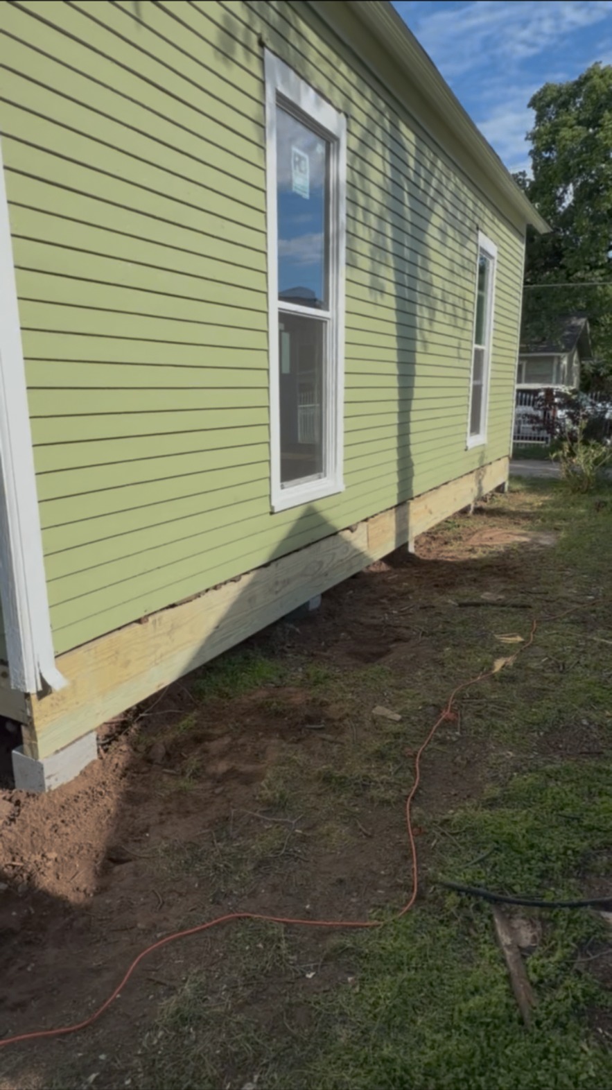 Completed new sill and support beam along a green home