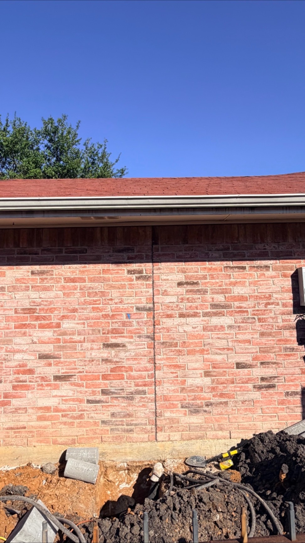 Brick wall after foundation repair with the crack closed